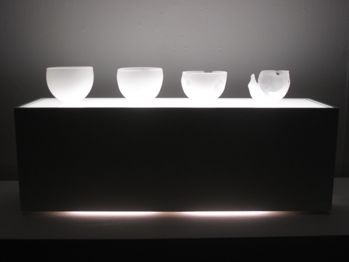 Blown and sandblasted glass bowls on a light box