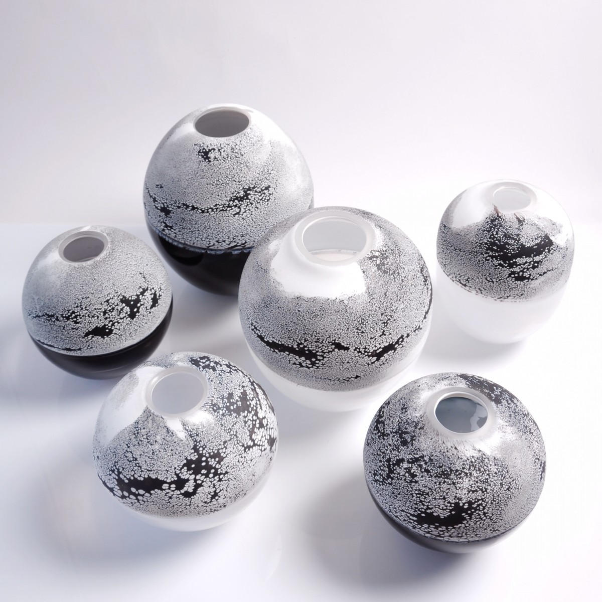 Six glass vases with black and white pattern