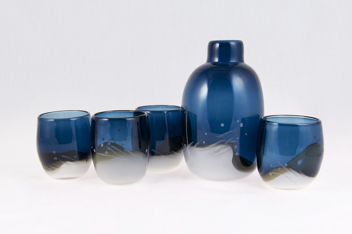 Blue and white blown glass flask with four glasses