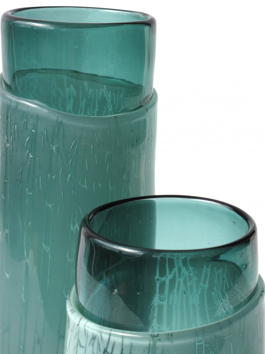 Detail of two green glass vases with engraved bamboo pattern